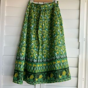 Cute green skirt with plant-themed print